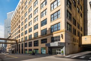 a large brick building on a city street at EVEN Hotel Pittsburgh Downtown by IHG in Pittsburgh