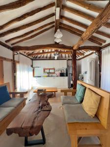a living room with a couch and a table at Hanok Stay - Jukrokjeongsa in Gurye