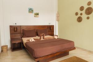 a bedroom with a bed with two snakes on it at Lost Paradise Sri Lanka in Mirissa