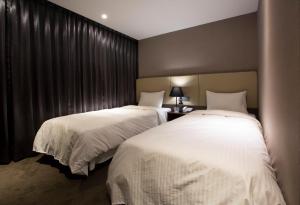 Кровать или кровати в номере Noble Hotel