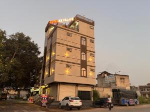 a tall building with lights on top of it at Hotel KK palace in Chittaurgarh