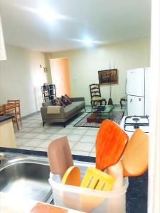 a living room with a kitchen and a living room with at Casa Rosa in Nanyuki