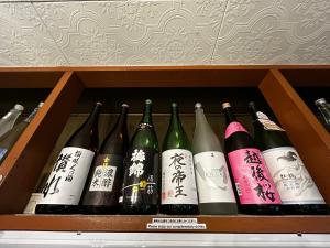 a bunch of bottles of wine in a drawer at Classy仏生山 in Takamatsu
