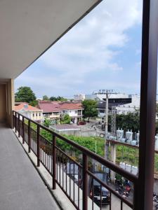 a balcony with a view of a parking lot at Central City Condo Getaway in Gun-ob