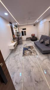 a large living room with a couch and a table at Chill Vibes in Visakhapatnam