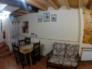a dining room with a table and chairs at Cal Fuster I in Todolella
