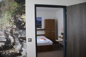 Postel nebo postele na pokoji v ubytování Hotel Pod Radnicí