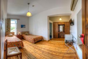 Postel nebo postele na pokoji v ubytování Alkisti City Hotel