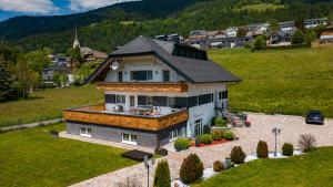 an aerial view of a house in a field at Appartements-Dalila in Sankt Michael im Lungau