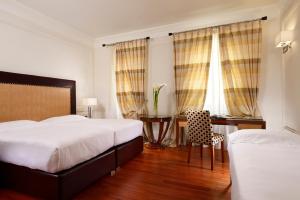 Cama ou camas em um quarto em UNA HOTELS Decò Roma