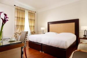 Cama ou camas em um quarto em UNA HOTELS Decò Roma