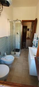 a bathroom with a shower and a toilet and a sink at nonna flo in Monterosso al Mare