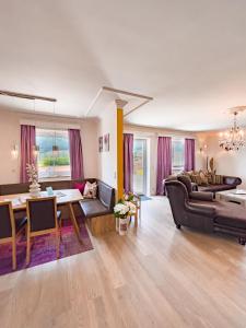 a living room with a couch and a table at Appartements-Dalila in Sankt Michael im Lungau