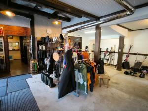 a store with a bunch of umbrellas on display at A Lucky Hostel in Hakuba