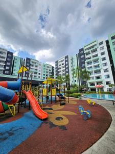 a playground with a slide and slides at Manhattan Condominium Ipoh in Ipoh