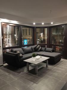a living room with a couch and a coffee table at Downtown Apartments Center in Baden-Baden