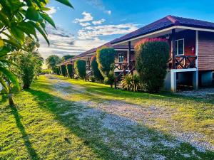 a house with a path next to it at Sai Klong Song Lae Resort Pakpra Phatthalung in Phatthalung