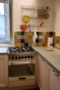 a kitchen with a stainless steel stove top oven at Lo Struzzo in Bagno di Romagna