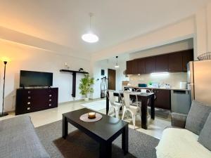 a living room with a couch and a table at Beauty Home Orestiada Center in Orestiada