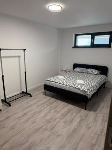 a bedroom with a bed in the corner of a room at EVEREST 33 Garsoniera in Bucharest
