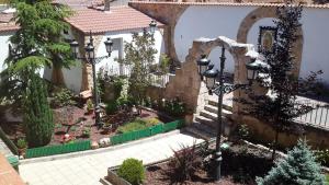 a house with a courtyard and a street light at La Hacienda de mi Señor in Lerma