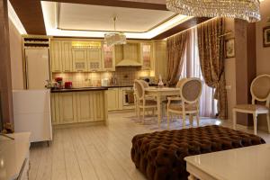 a kitchen with a table and a dining room at Апартамент за гости Марица in Asenovgrad +8 photos