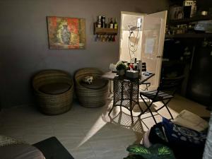 a living room with a table and some stools at Sla guest house in Boracay