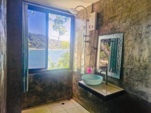 a bathroom with a sink and a large window at Family view A3 -Kantiang paradise resort- in Ko Lanta