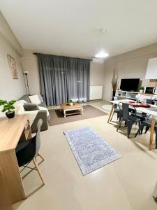 a living room with a couch and a table at Beauty Home Orestiada Center in Orestiada