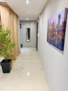 a corridor of an office with a painting on the wall at Beauty Home Orestiada Center in Orestiada