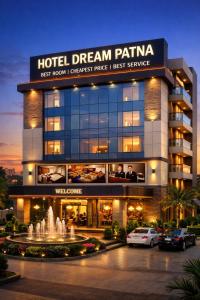 a hotel dream patina with a fountain in front of it at Hotel Dream Patna in Patna