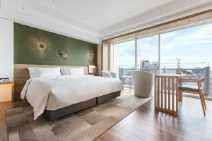 a bedroom with a large bed and a large window at The Prince Park Tower Tokyo - Preferred Hotels & Resorts, LVX Collection in Tokyo