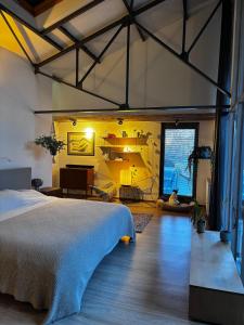 a bedroom with a large bed in a room at Stylish Loft with Industrial Charm in Kortenberg