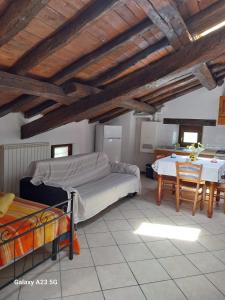 a bedroom with a bed and a table in a room at La corte dei celti 9 in Quinzano