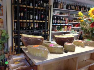 a store filled with lots of different types of cheese at Affittacamere Valle Dorizzo di Scavoni Paolo in Val Dorizzo