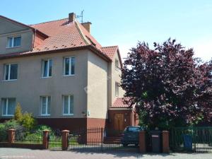 a house with a car parked in front of it at Moniuszki24 in Świnoujście