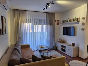 a living room with a couch and a table at Avram in Vrnjci