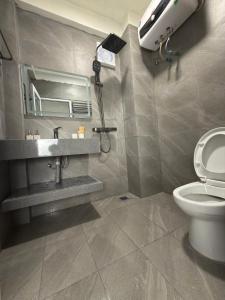 a bathroom with a sink and a toilet at FIRONA FLY HOTEL in Sapa +12 photos