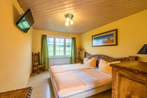 Postel nebo postele na pokoji v ubytování Motel Steighof