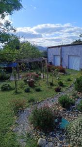 a garden with a fence and a building at chalet 2 in Saint-Christol-lès-Alès