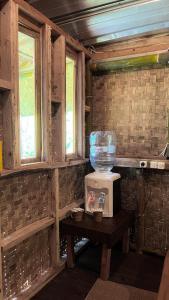 a microwave sitting on a table in a room at ALAMSUKA Cikole in Tangkubanperahu