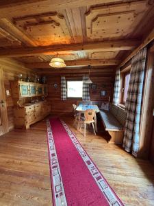 a room with a table and a dining room at Almhütte Astental in Vordere Asten +26 photos