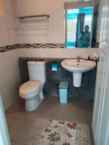 a bathroom with a toilet and a sink at Bedroom301 Kata Beach Phuket in Kata Beach