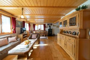 a living room with a couch and a table at Sonnegge in Wildhaus