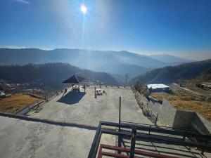 a large amphitheater on top of a mountain at The Terraces by 12th Avenue in Murree