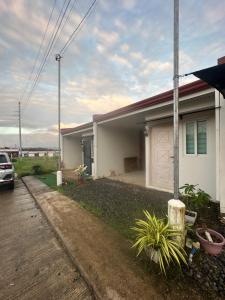 a house with a car parked in front of it at Ormoc Gdex Transient in Ormoc