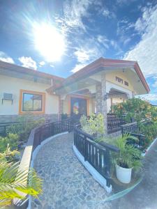 a house with a walkway in front of it at BICAMM Inn in Sampong