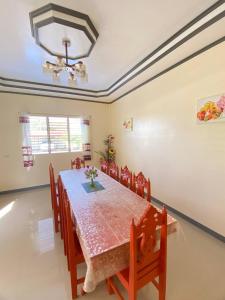 a dining room with a table and chairs at BICAMM Inn in Sampong