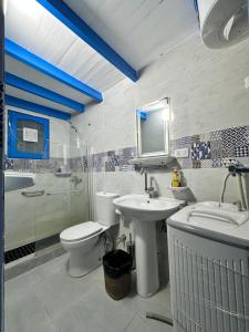 a bathroom with a toilet and a sink and a shower at Amnesia Residence in Naama Bay - Downtown in Sharm El Sheikh +41 photos