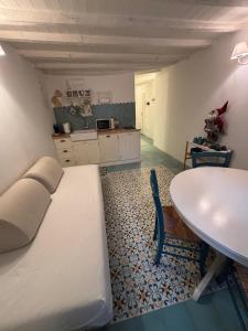 a room with a bed and a table and a table at A Casa di Letta in Santa Margherita Ligure +11 photos